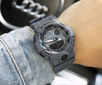 Casio G-Shock gray resin watch with round digital display and textured bezel