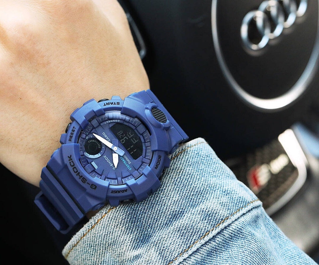 Casio G-Shock blue resin watch with round digital display and chunky strap