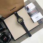 Casio G-Shock watch with dark blue strap and gold-tone skeleton dial