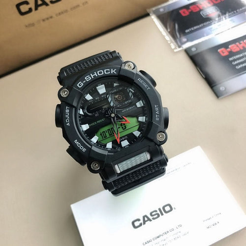Casio G-Shock watch with black case, black bezel, and green dial accents on black strap