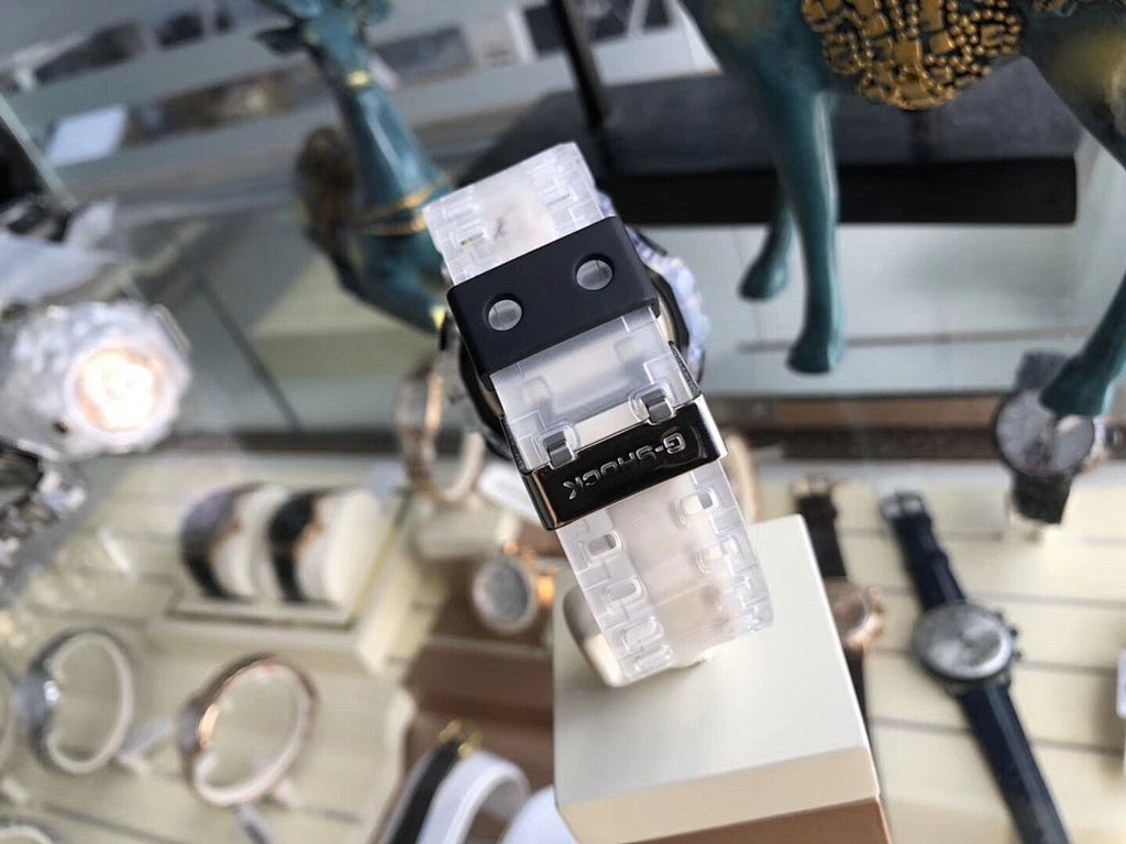 Casio G-Shock watch side view with clear resin strap and black crown section