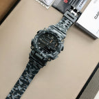 Casio G-Shock watch with camo strap and black dial from angled top view