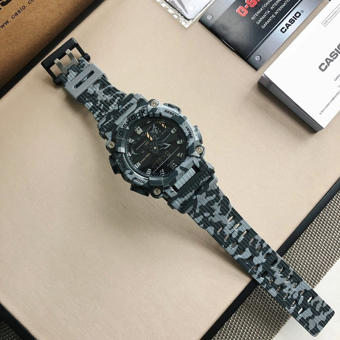 Casio G-Shock watch long camo strap with black dial and silver-tone bezel