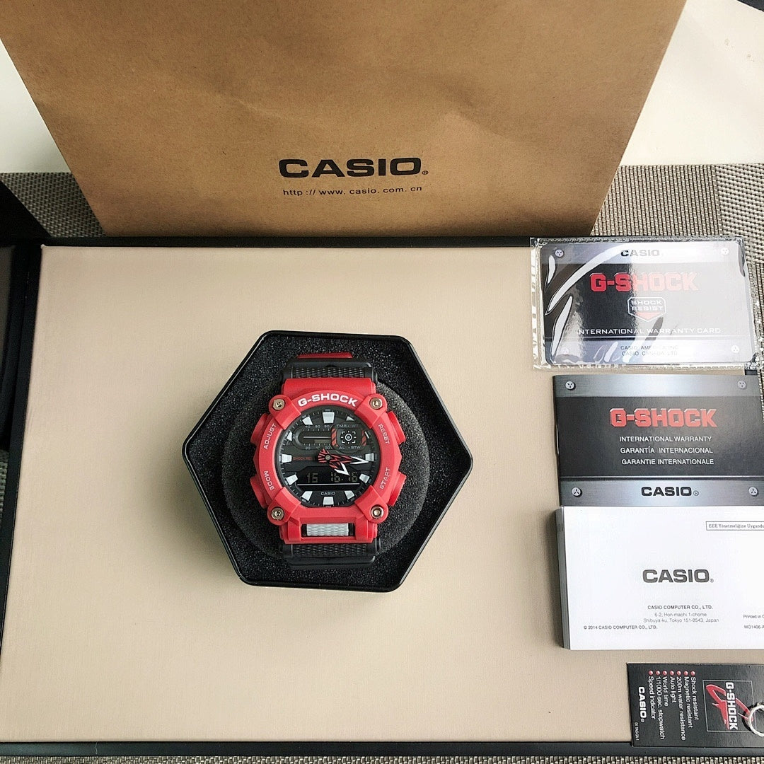 Red and black G-Shock watch in black display cushion with strap