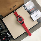 Red G-Shock watch with red perforated strap and black dial housing