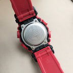 Red G-Shock watch caseback with silver back plate and black strap links