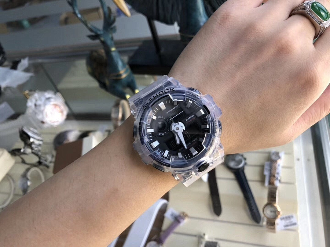 G-Shock watch on wrist with clear strap and black dial