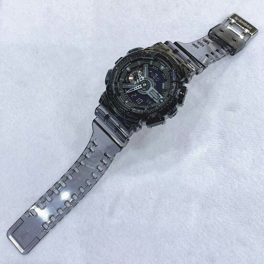 Casio G-Shock style wristwatch laid sideways with black resin strap and round multi-dial face