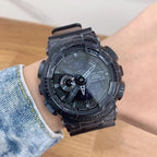Casio G-Shock style wristwatch on wrist with dark transparent bezel and multi-dial dial