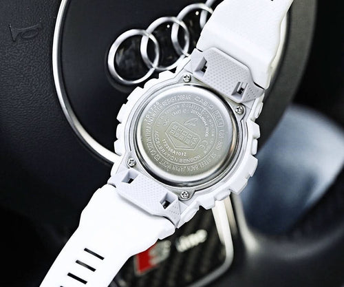Casio watch with white resin strap, case back close-up.