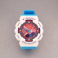 G-Shock wristwatch with white resin case, red bezel, and blue strap