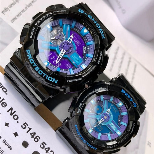 Black Casio G-Shock watch with blue and purple digital dial on a black resin strap