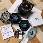G-Shock watch set with black resin straps, blue dial on included packaging and documents