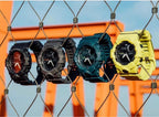 Casio watches hanging: dark, teal, teal-green, and yellow resin straps with digital faces