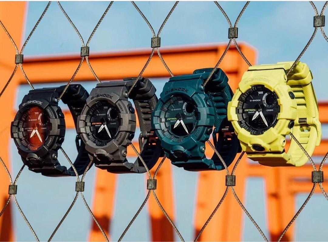Casio watches hanging: dark, teal, teal-green, and yellow resin straps with digital faces