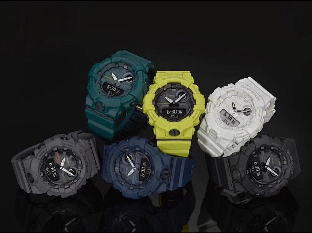 Set of Casio watches with teal, yellow, white, and dark straps and round digital faces