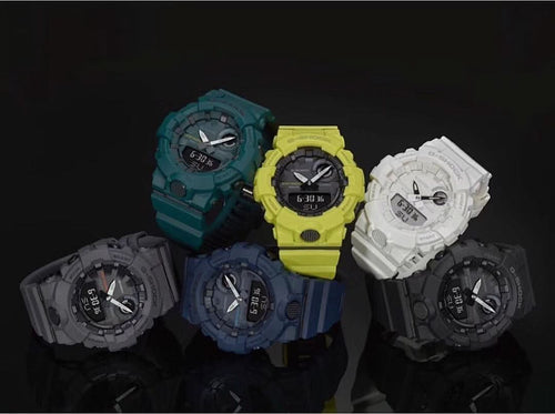 Set of Casio watches with teal, yellow, white, and dark straps and round digital faces