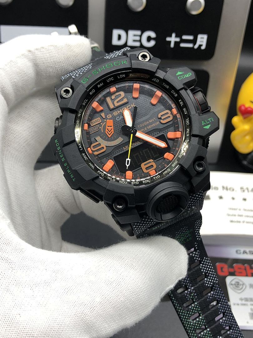 Casio watch with black case, orange hands, and textured patterned strap
