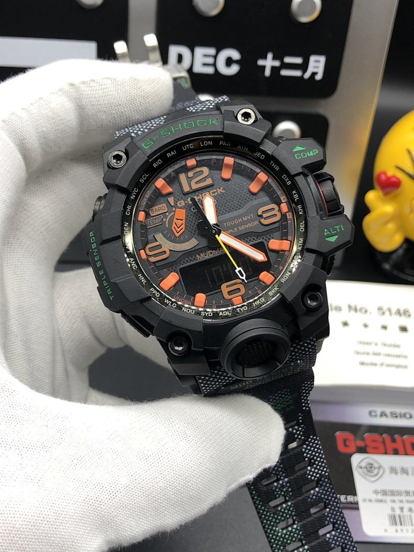 Casio watch face with orange numerals and black chunky bezel