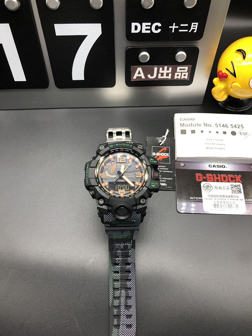 Casio watch on tabletop with black case and green patterned strap