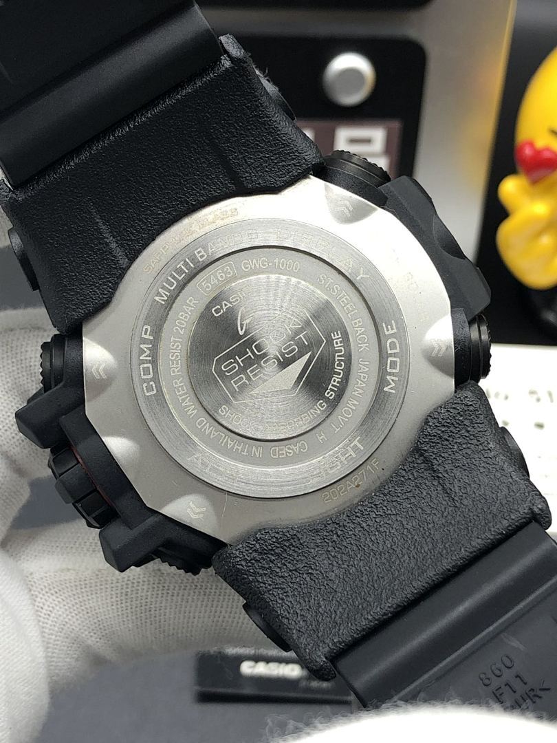 Casio watch caseback on black textured strap with brushed metal back plate