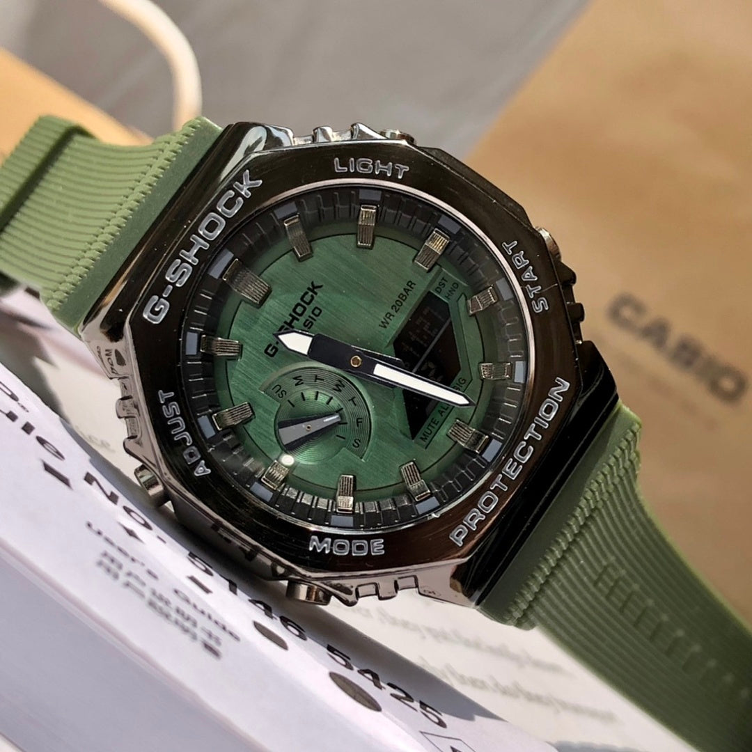 Casio G-Shock wristwatch front, green resin strap, black bezel, green dial with hands