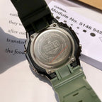 Casio G-Shock wristwatch back, stainless backplate with screws, green resin strap