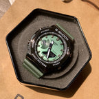 Casio G-Shock wristwatch, green dial, black bezel, green resin strap in display tray
