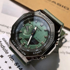 Casio G-Shock wristwatch close-up, green dial, black bezel, green resin strap