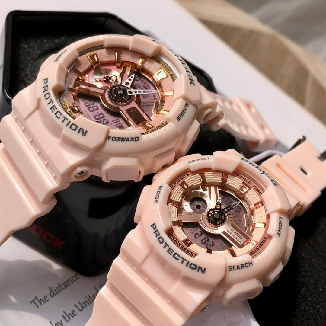 Light pink resin wristwatch pair in open cases with round skeleton dials and bezels