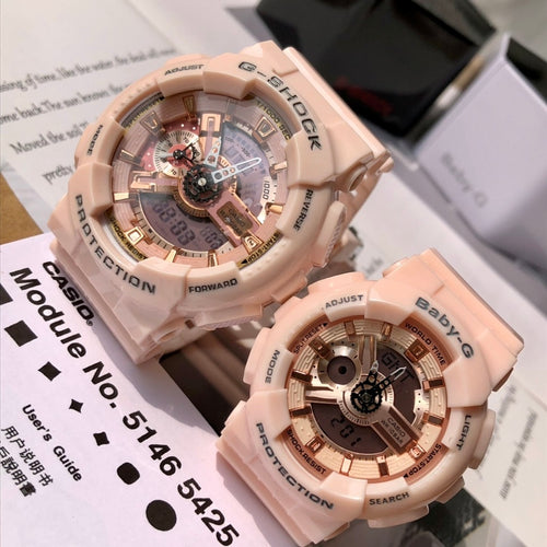 Pair of light pink resin wristwatches with round skeleton dials and digital markers