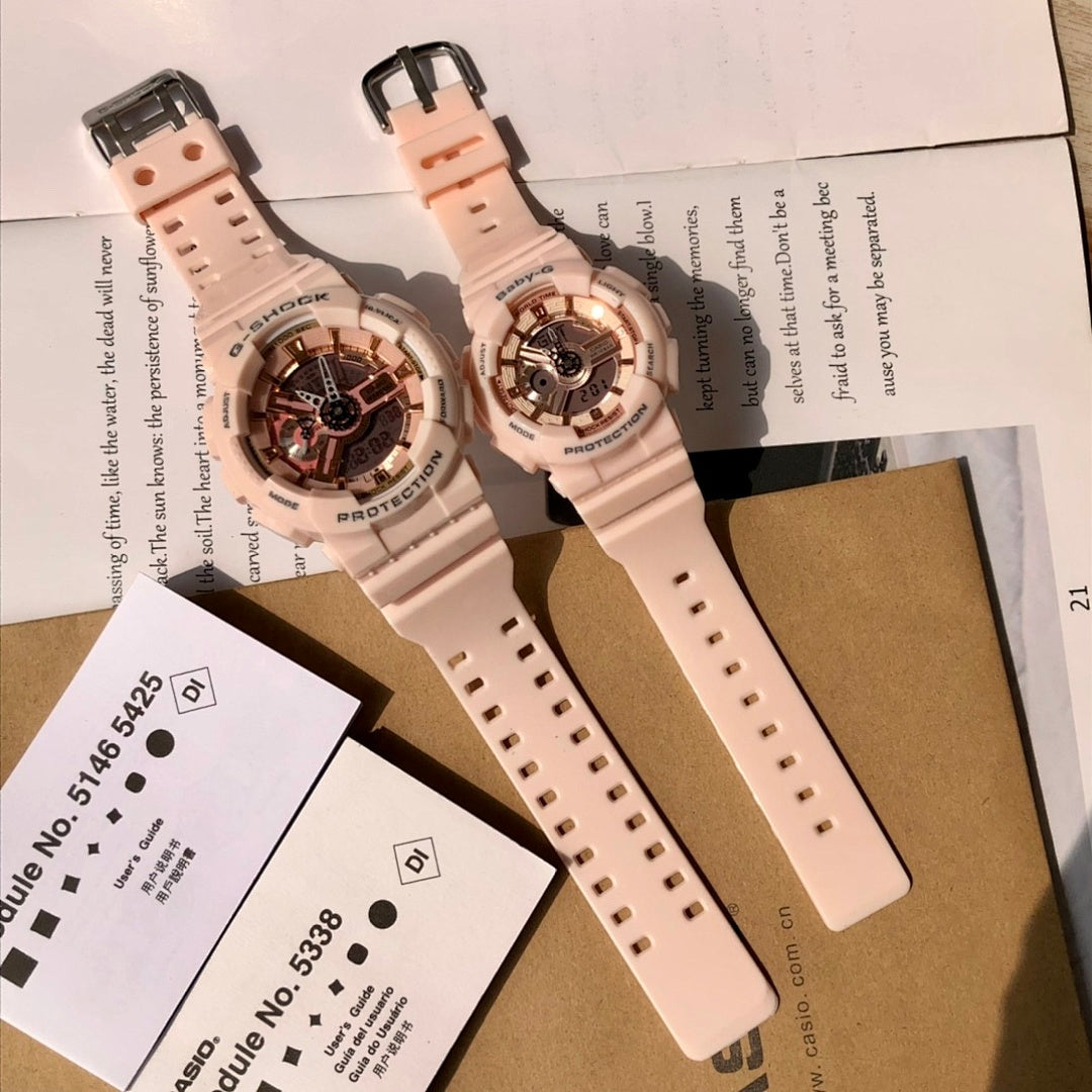 Two light pink resin wristwatches on packaging cards, showing straps and round cases