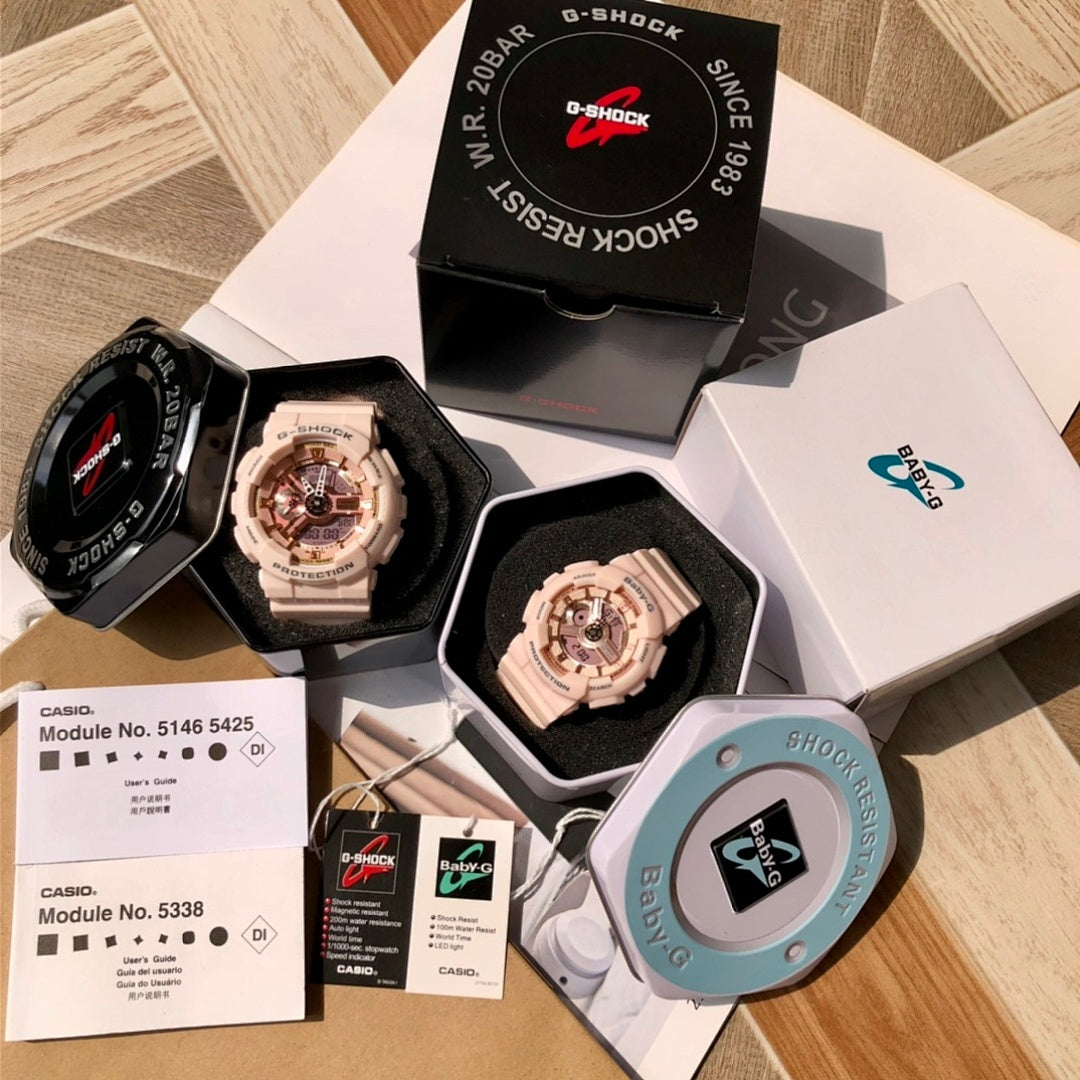 Wristwatch set in retail boxes with black and light pink watches plus paperwork