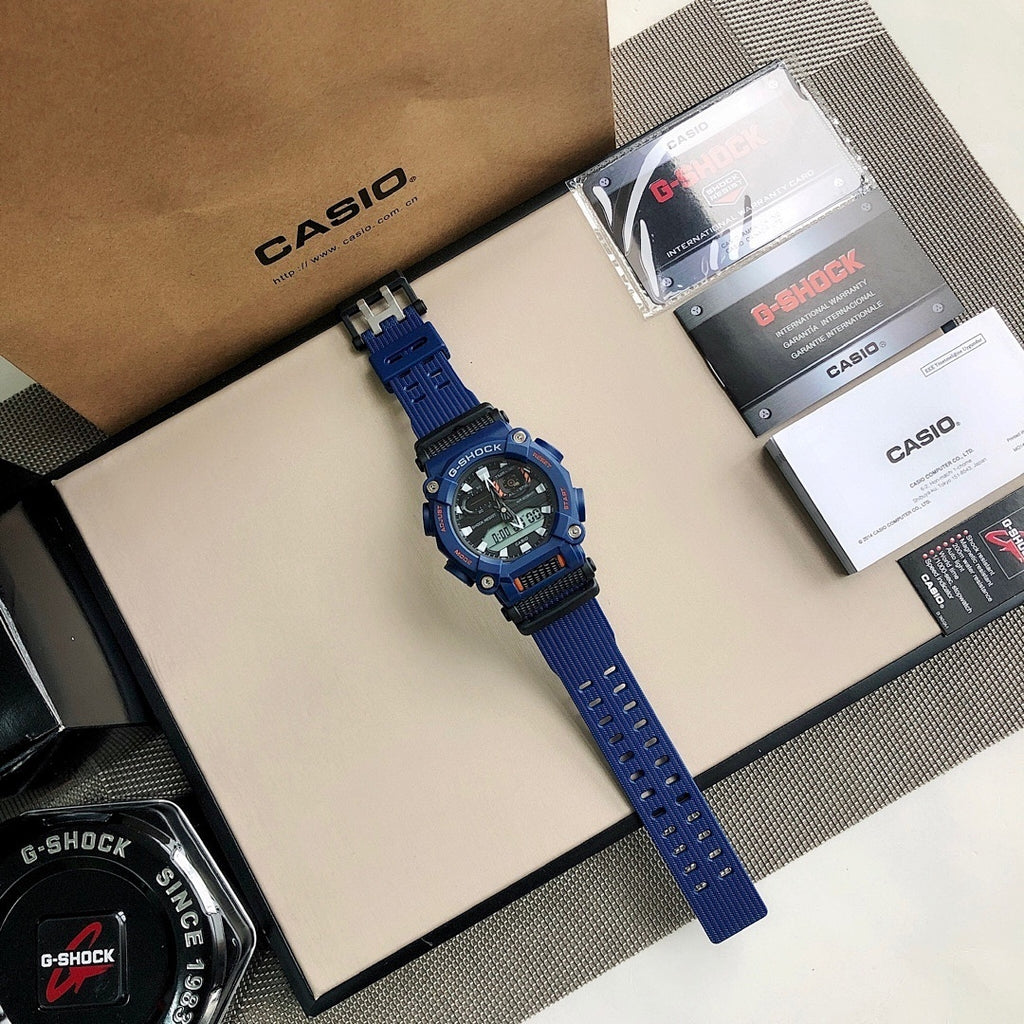 Casio G-Shock watch with blue strap, black dial with green digital numerals
