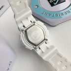 Casio resin watch case with metal clasp and engraved case back on white band