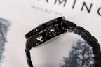 Casio watch crown and side buttons on black steel bracelet