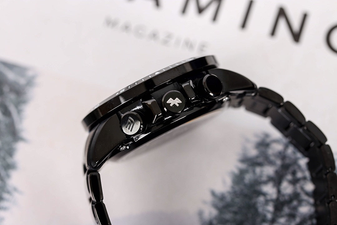 Casio watch crown and side buttons on black steel bracelet