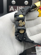 Casio G-Shock wristwatch side profile with gold-toned crowns and black strap