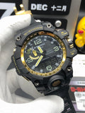 Casio G-Shock wristwatch with black case, gold bezel accents, green dial details