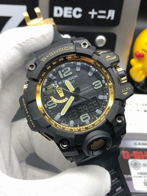 Casio G-Shock wristwatch with black case, gold bezel accents, green dial details