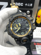 Casio G-Shock wristwatch angled on black strap with gold bezel and green details
