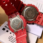 Two red Casio watches showing backs with metal cases and embossed markings
