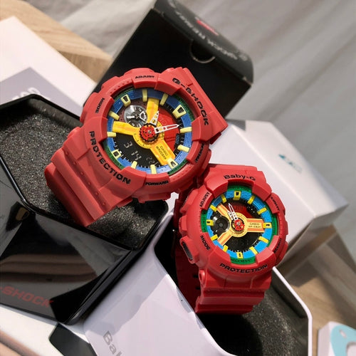 Red Casio watch with colorful rotating dial, red resin strap, and rugged bezel