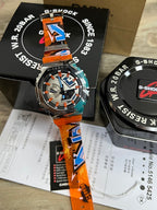 Casio G-Shock watch with orange and blue strap and patterned dial