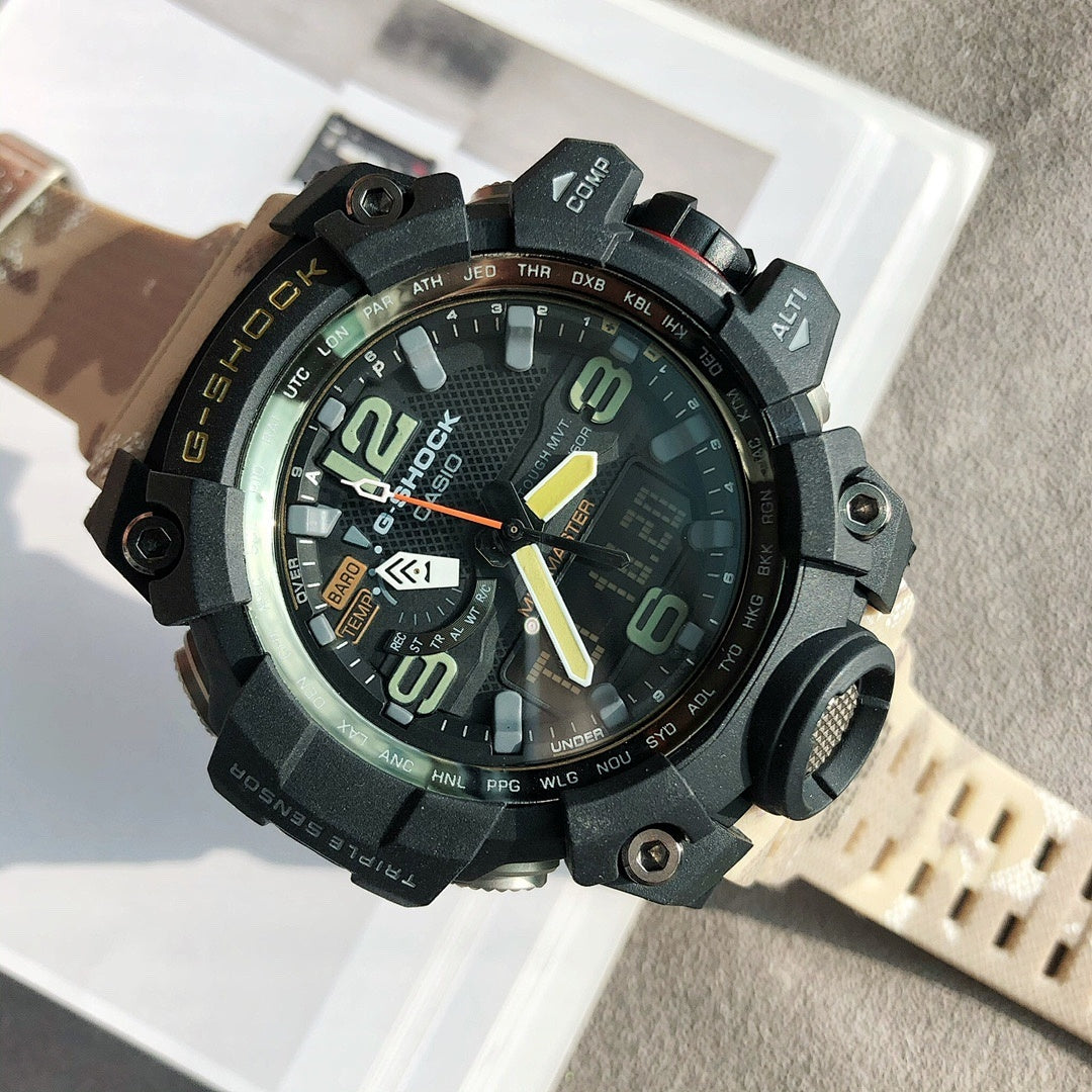 G-Shock digital watch with black case, bright orange hands, and beige perforated strap