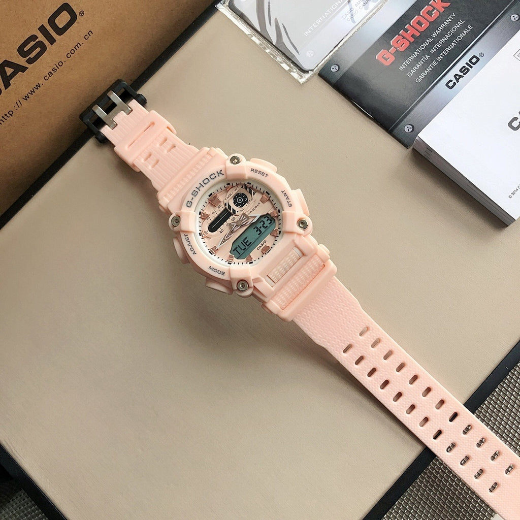 Pink resin G-SHOCK wristwatch with black buckle and round digital face.