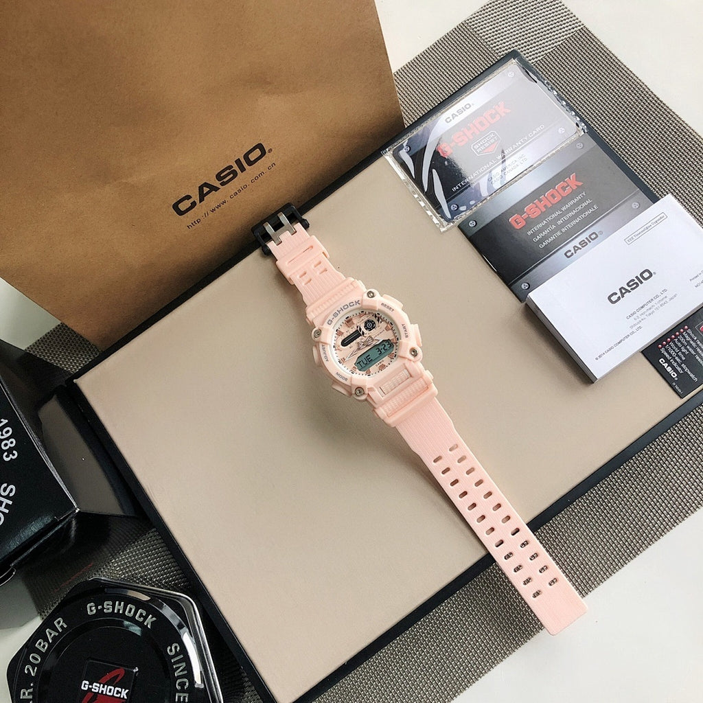Pink resin G-SHOCK wristwatch with extended perforated strap and digital display.
