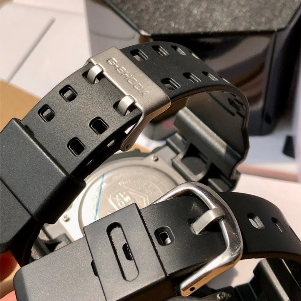 Black resin Casio watch with metal buckle and strap adjustment holes