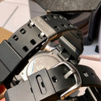 Black resin Casio watch with metal buckle and strap adjustment holes