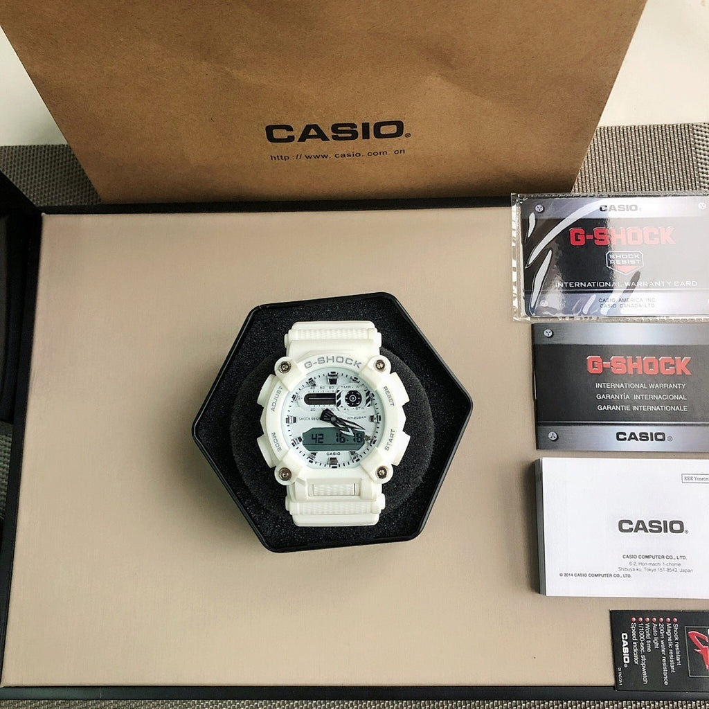 White G-SHOCK watch in a hexagonal box with instruction cards and spare packaging